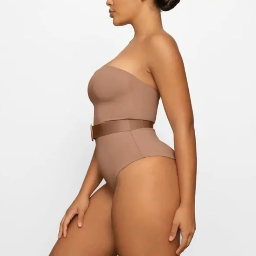 Skims sculpting one piece belted.